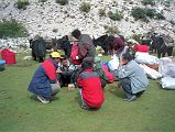 7 1 Yak Herders Getting Loads Ready I watched as the different loads were put together. The lead yak herder lifted each one and spoke to Tashi who told Kumar to redistribute the weight. After fifteen minutes, all was ready. Tashi assigned a small stiff piece of paper to each load, turned around and mixed up the paper, and randomly handed them out to each yak herder. It looked like a great way to ensure fair play.